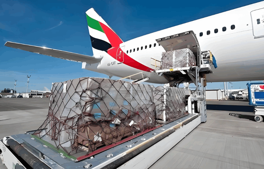 Cross-border air freight cargo being loaded into Emirates aircraft for international shipping