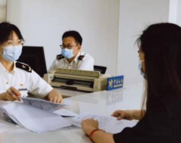 Air freight customs clearance process with officers reviewing shipment documents
