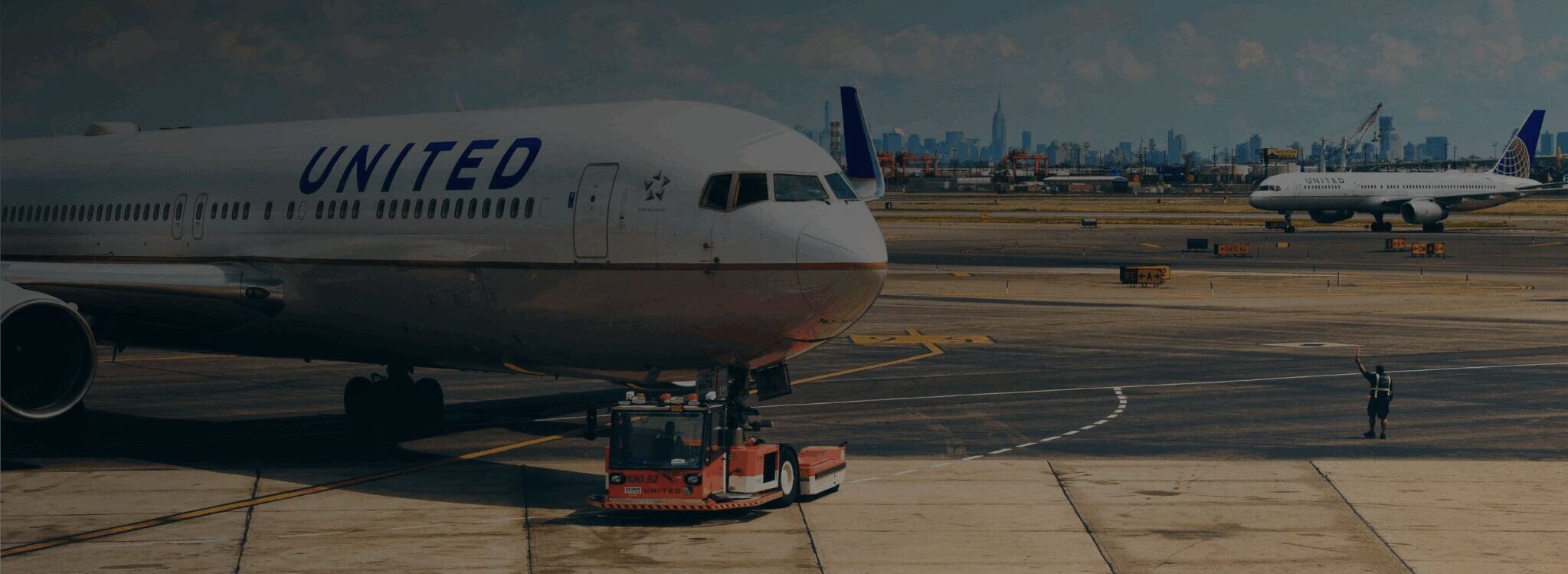 United Airlines aircraft at airport preparing for cross-border air freight logistics